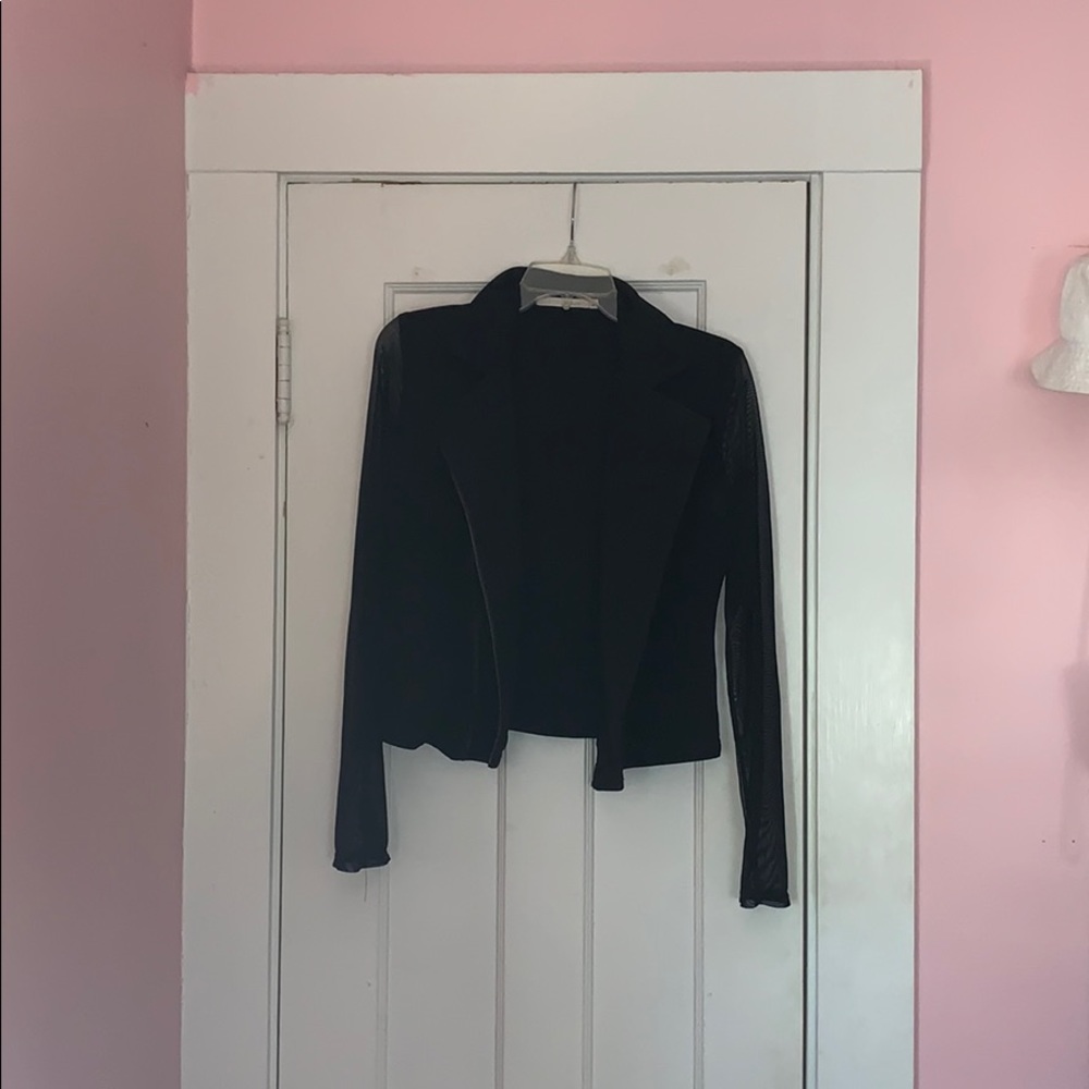 Lightweight jacket with sheer sleeves.